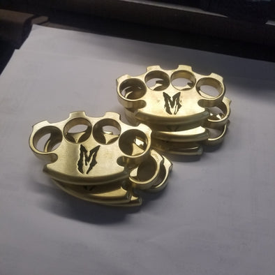 **Brass paperweight or knuckles**